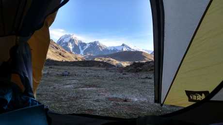 Sunrise at Huchuy Phinaya campsite with a backdrop of the three peaks