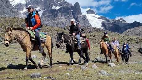 Horseback trekking in Ausangate with glacier landscapes and mountains of southern Peru